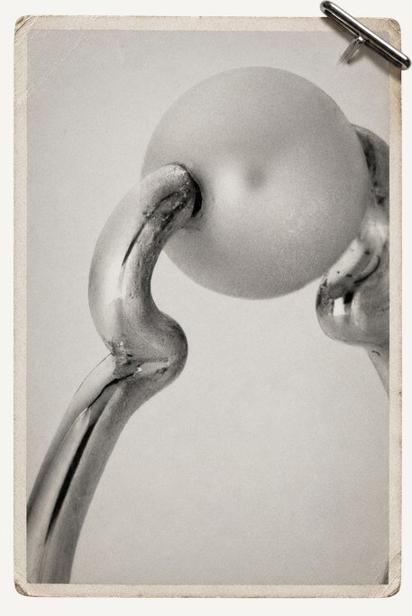 Cast silver form with a pearl