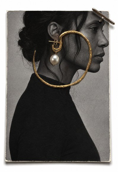 Profile wearing the large gold hoop