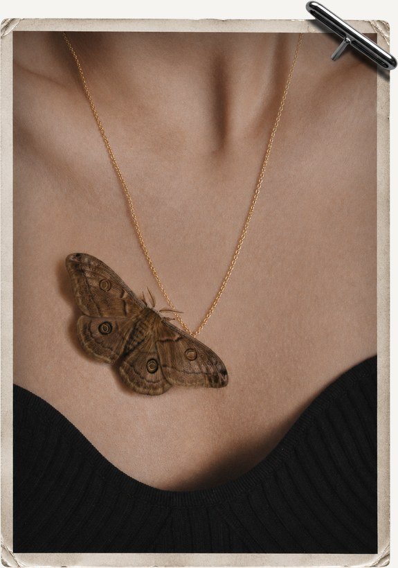 Moth pendant worn at the chest