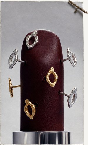 Rings arranged on a dark red form