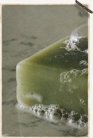 Green stone set with pavé diamonds