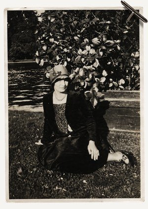 Archival portrait, seated in a garden